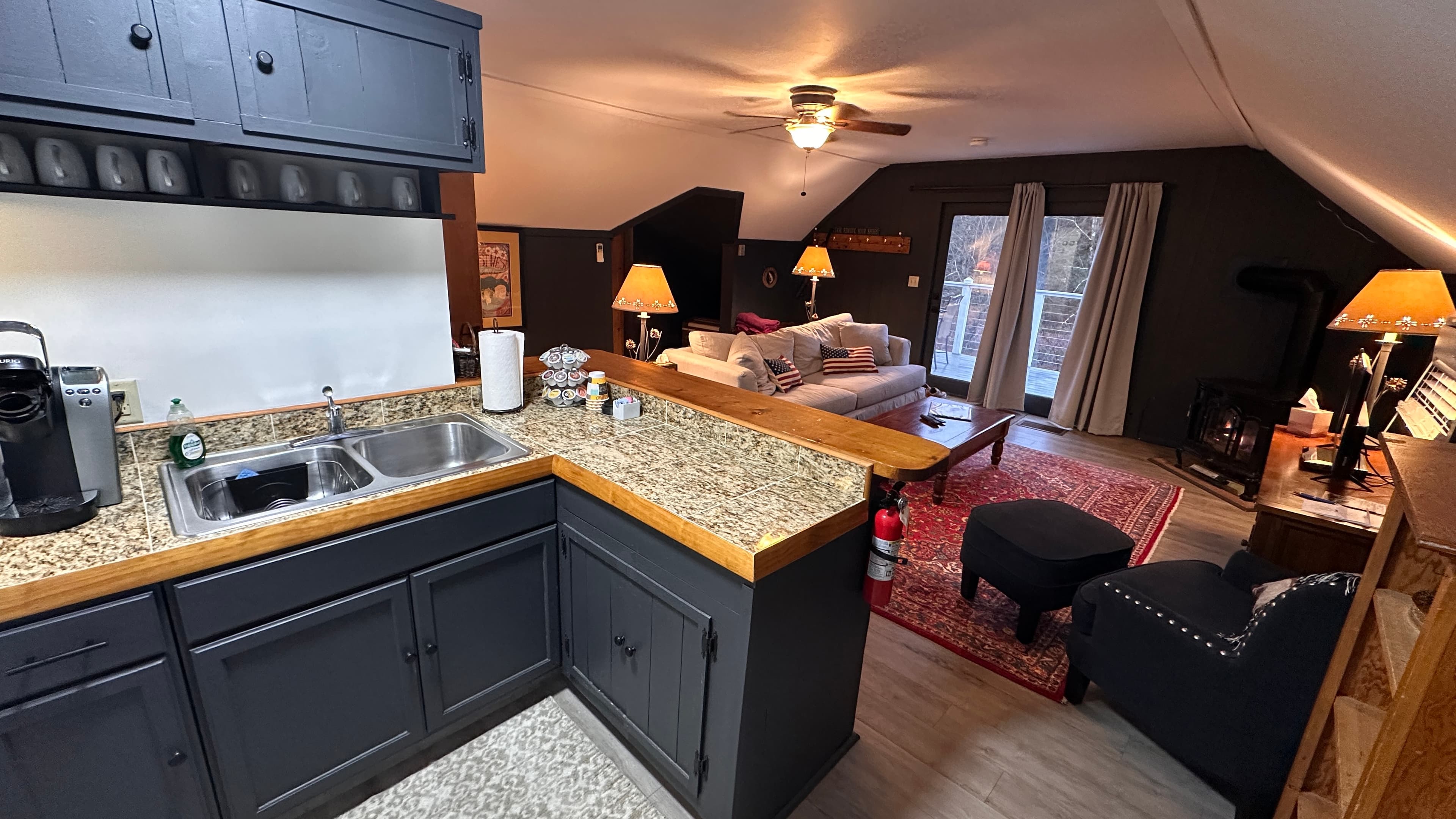 Full kitchen with stove, oven, refrigerator, coffee maker, and sink